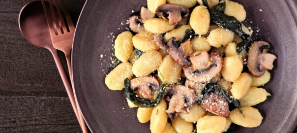 Gnocchi,With,Mushrooms,In,A,Brown,Butter,Sage,Sauce.,Top