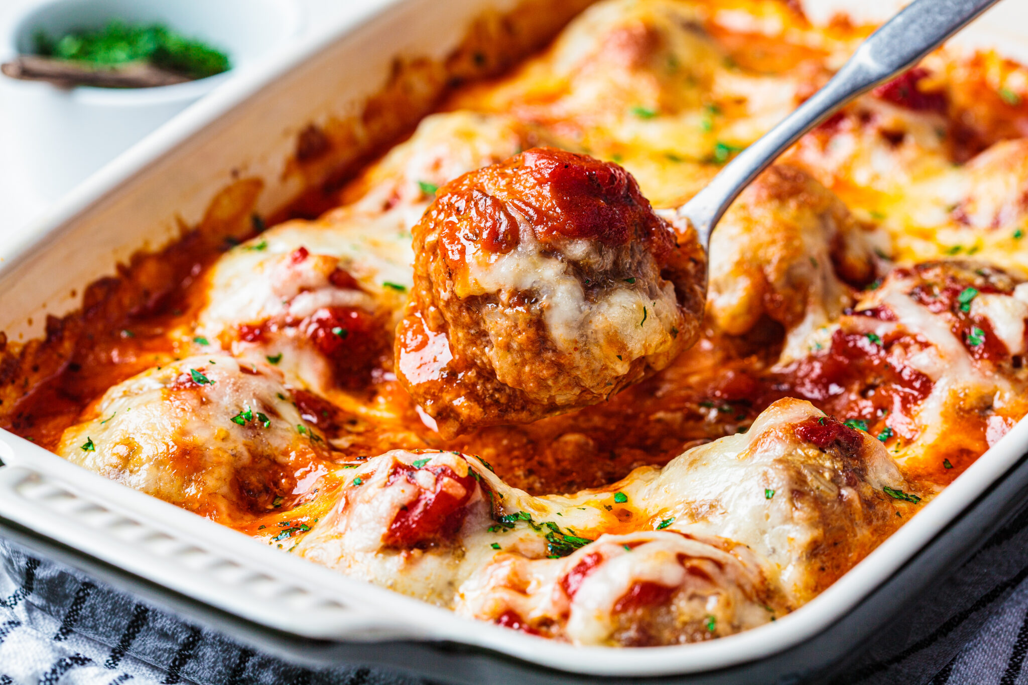 Baked,Cheesy,Meatballs,Casserole,With,Tomato,Sauce,In,The,Oven