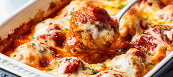 Baked,Cheesy,Meatballs,Casserole,With,Tomato,Sauce,In,The,Oven