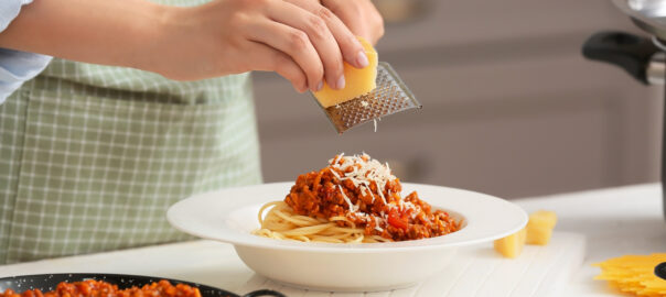 Woman,Cooking,Tasty,Pasta,Bolognese,In,Kitchen,,Closeup