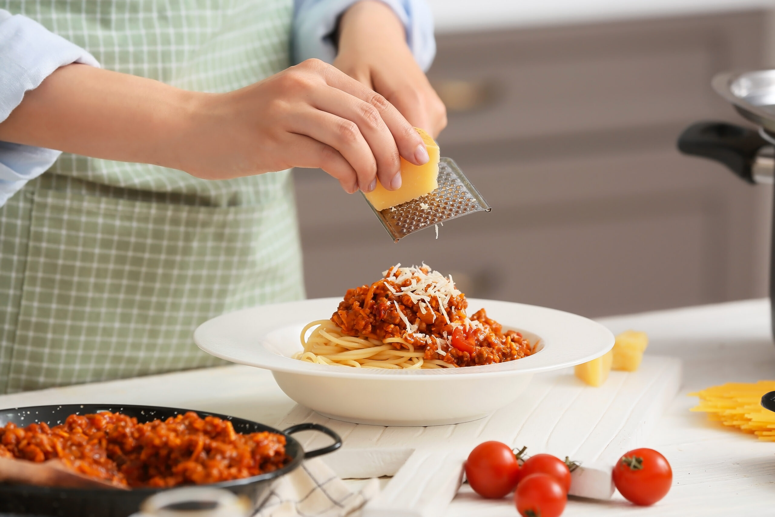 Woman,Cooking,Tasty,Pasta,Bolognese,In,Kitchen,,Closeup